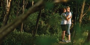 Two men hugging in the woods