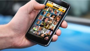 Person on Grindr on their phone
