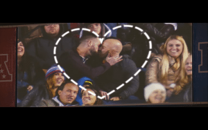 Two men kiss in an NFL PSA video