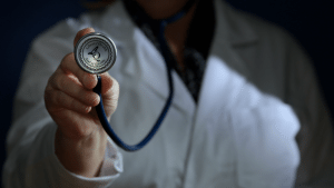 Doctor holding up a stethoscope
