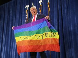 Trump holding LGBT flag