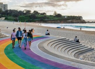 Couples walking along the rainbow path at Coogee Beach, Coogee.